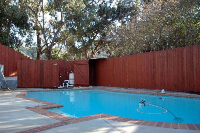 Redwood stain fence pool renovation
