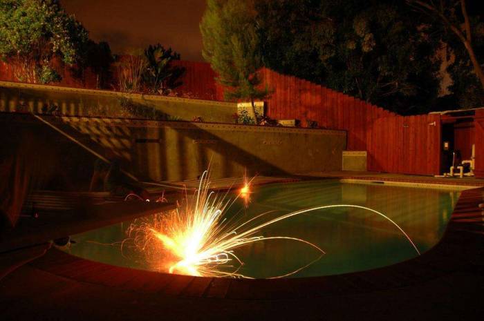 Bottle rocket firework pool night long exposure