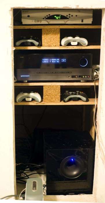 Entertainment system with shelving xbox cable audio woofer