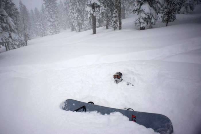 Snow Tahoe powder snowboarder buried