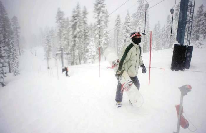 Tbar lift snowboarders walking snow Tahoe lol