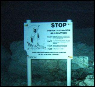 Cenote dive Cancun Mexico warning sign grim reaper