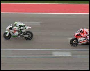 2014 MotoGP Austin Texas Andrea Dovizioso overtake front straight panned