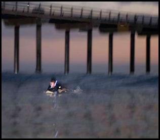 Night surf nightsurf Scripps Pier paddle led lights Scripps Pier sunset