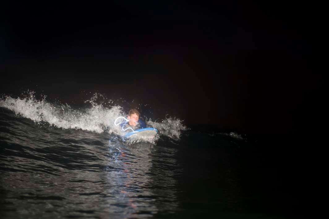 Night surf nightsurf Scripps Pier paddle wavestorm