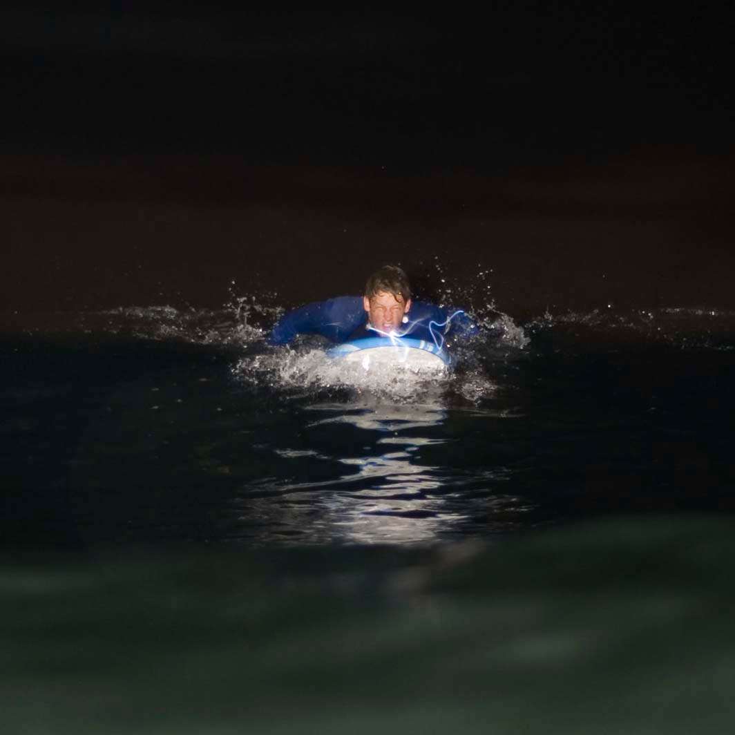 Night surf nightsurf Scripps Pier paddle wavestorm led lights
