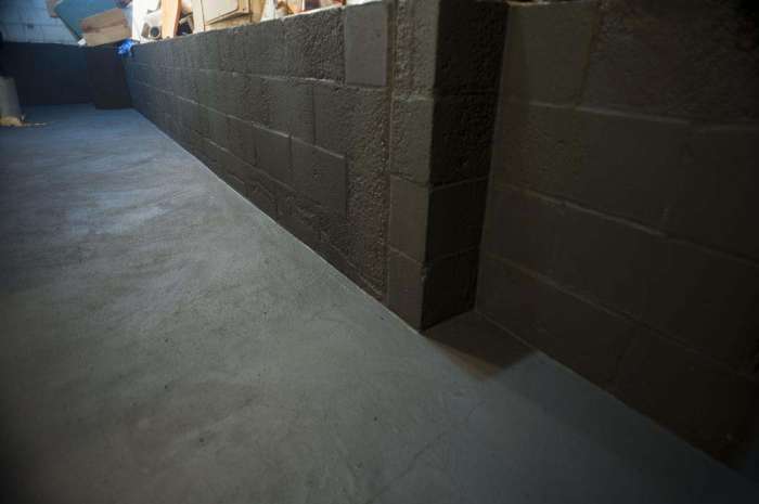 Concrete sealer coating murder room cinder block