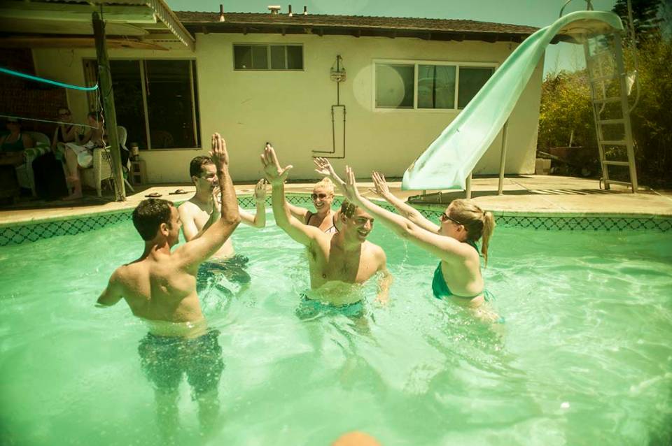Pool volleyball high five