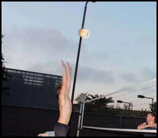 Beach volleyball block low light