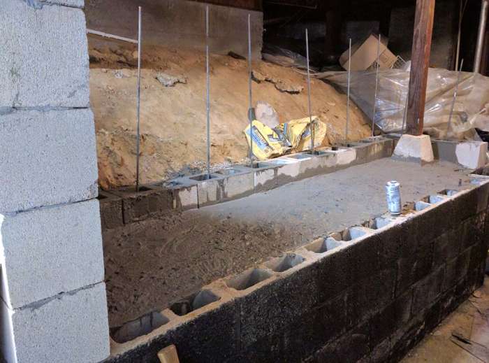 Renovation murder room concrete pour cinder blocks shelf