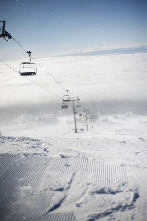 Skiing snowboarding Mount Hood peak lift weather view clouds