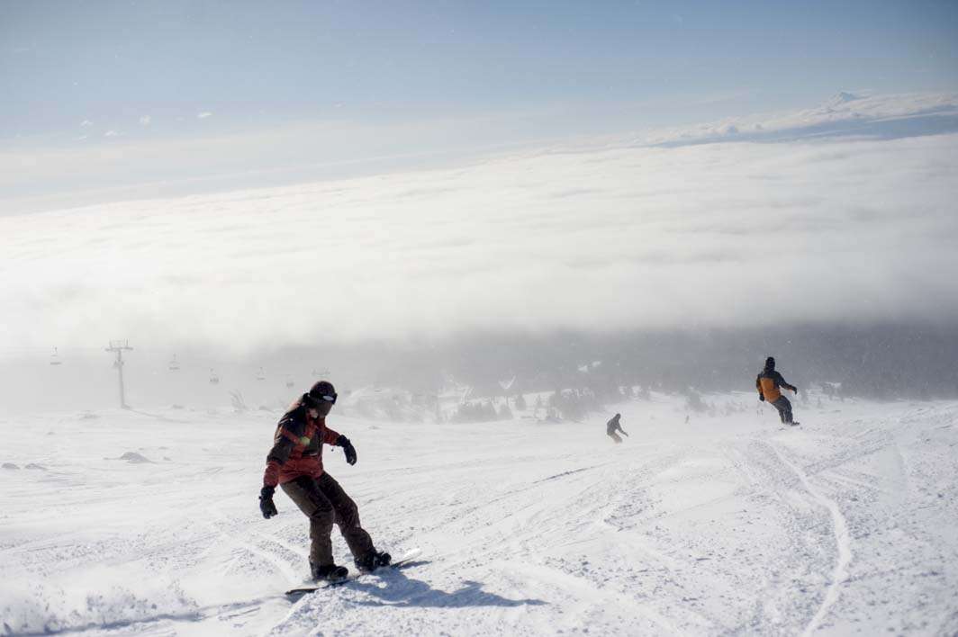 Skiing snowboarding Mount Hood peak weather view clouds